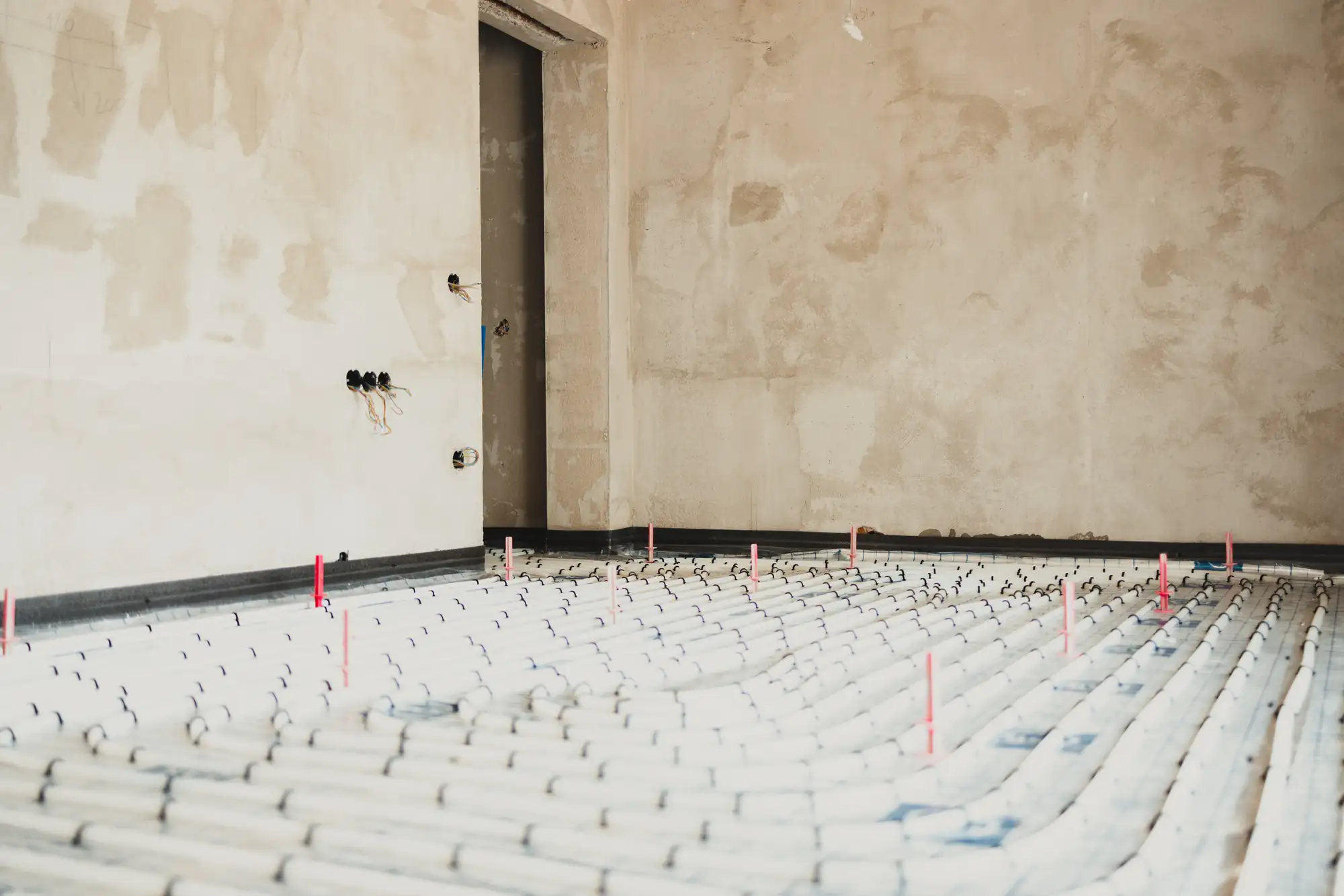Underfloor heating system installation in a building under construction
